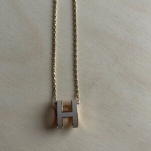 Hermes Mini Pop H pendant in color Marron Glace